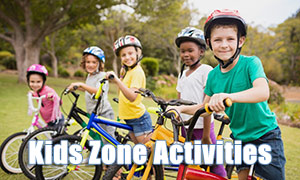 Kids on bikes on their way to the Kids Zone